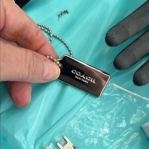 Coach Silver Tone Rectangular Logo Tag with Ball Chain